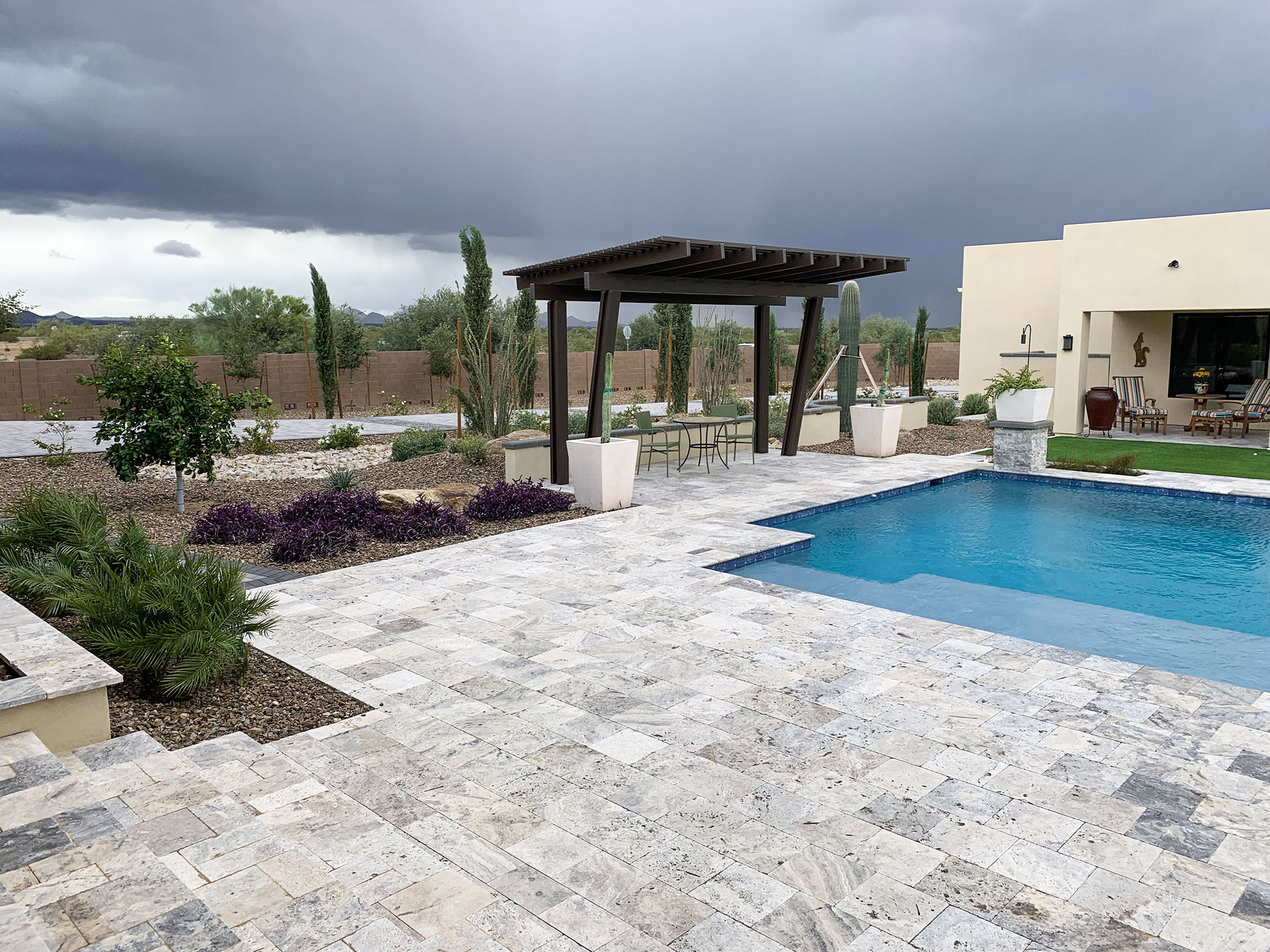 Backyard pavers and Pergola for new build during storm