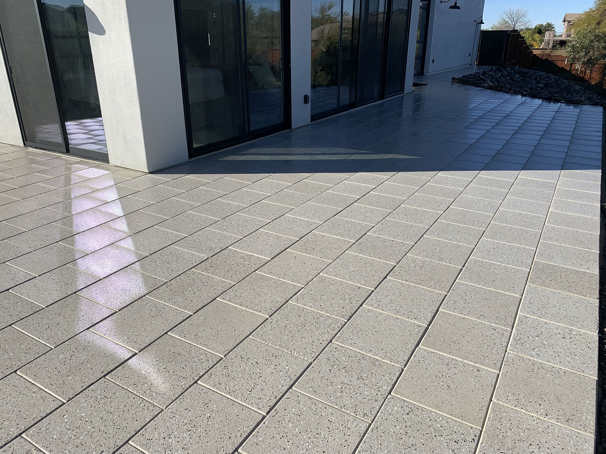 Shiny Granite Pavers in backyard